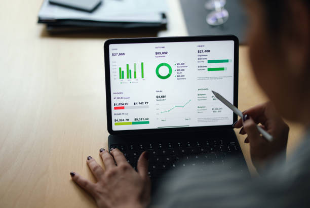 istock View From Behind of an Anonymous Woman Using a Tablet (Copy Space) 1448331359