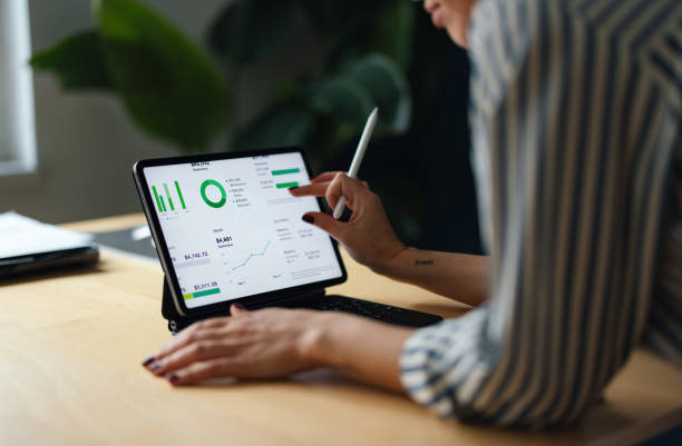 istock View From Behind of an Anonymous Woman Using a Tablet (Copy Space) 1448331384