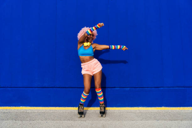 istock Beautiful woman skating with roller skates and having fun. 1448335497