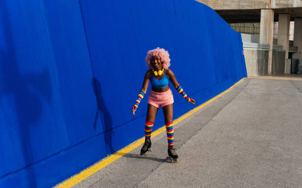 istock Beautiful woman skating with roller skates and having fun. 1448336200