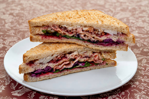 istock Christmas sandwich of turkey, bacon and stuffing 1448336825