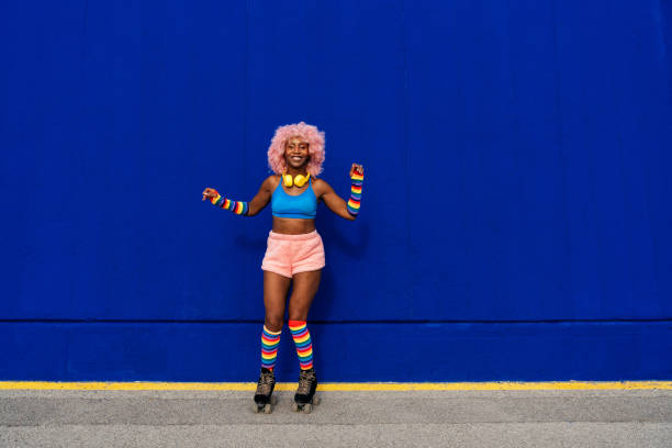 istock Beautiful woman skating with roller skates and having fun. 1448338691