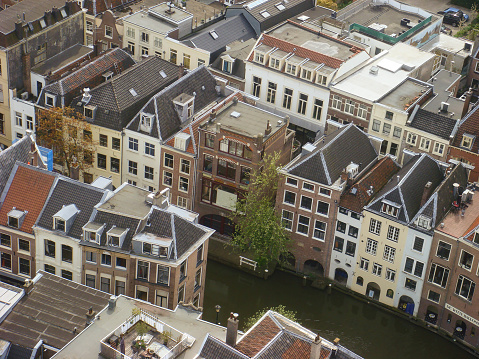 Roofs and facades of Amsterdam. City view to the south from the bell tower of the church Westerkerk, Holland, Netherlands.