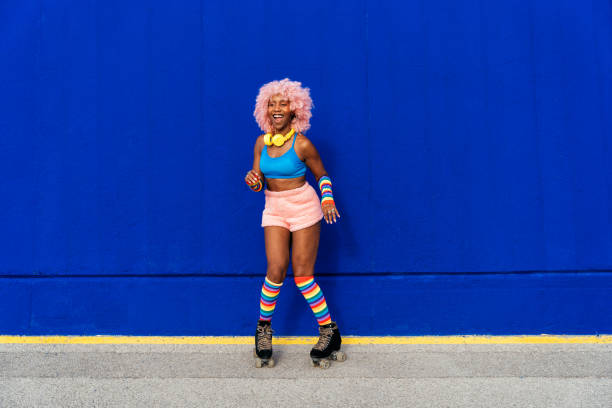 istock Beautiful woman skating with roller skates and having fun. 1448339836
