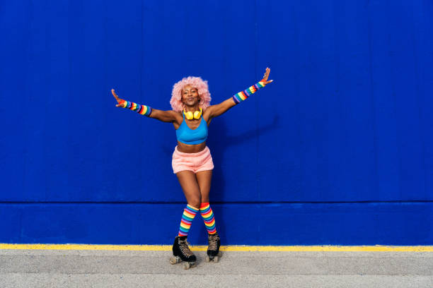 istock Beautiful woman skating with roller skates and having fun. 1448340929