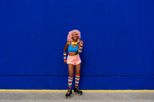 istock Beautiful woman skating with roller skates and having fun. 1448341111