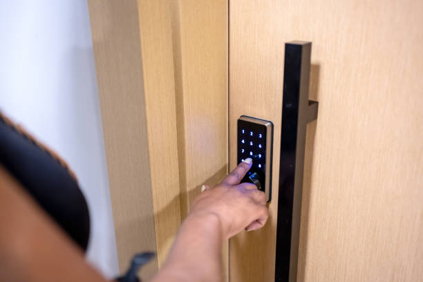 istock Woman using electronic card to open the door 1448342814