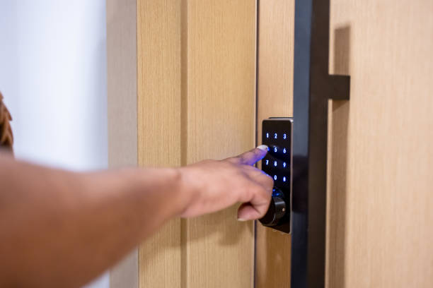 istock Woman using electronic card to open the door 1448342818