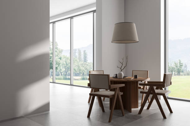 istock Light living room interior with eating table and chairs, panoramic window 1448344877