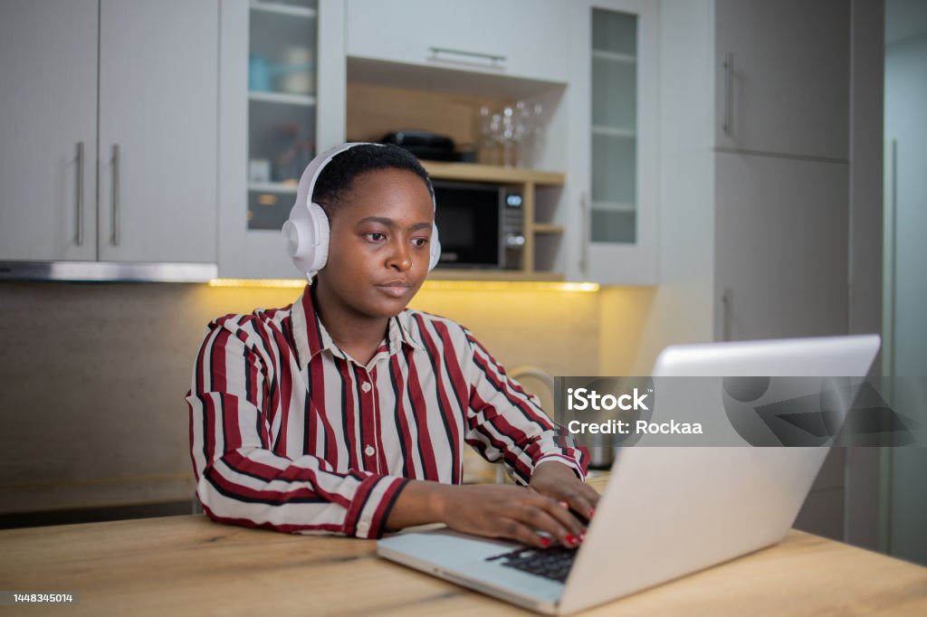 Woman working from home Getting her home business up and running 20-24 Years Stock Photo