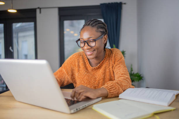 istock Young woman working from home 1448345200
