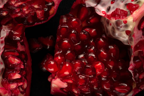 istock Close-up of ripe pomegranate seeds. 1448345307