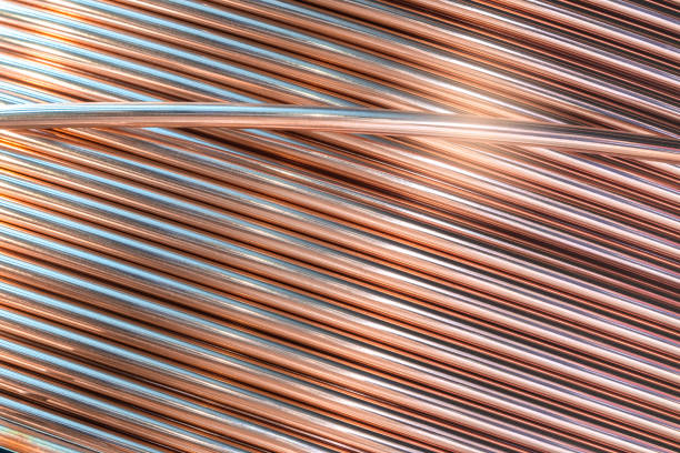 Coil of copper wire for welding tools and other industrial applications, industry concept background