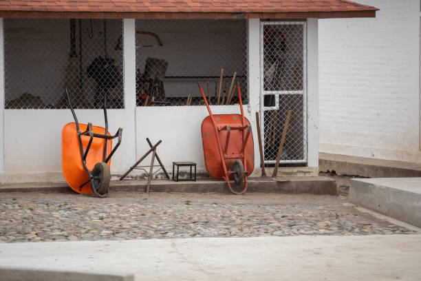 details construction material with infrastructure of a house, details of wheelbarrows, tools and objects