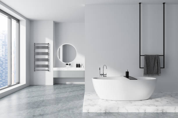 istock Stylish bathroom interior with tub and sink with panoramic window. Mockup wall 1448346597