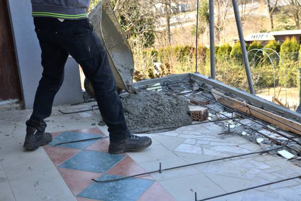 istock Construction of the floor at the house by hand using a wheelbarrow 1448346804