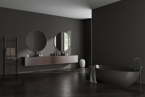 istock Corner view on dark bathroom interior with bathtub, double sink 1448347247