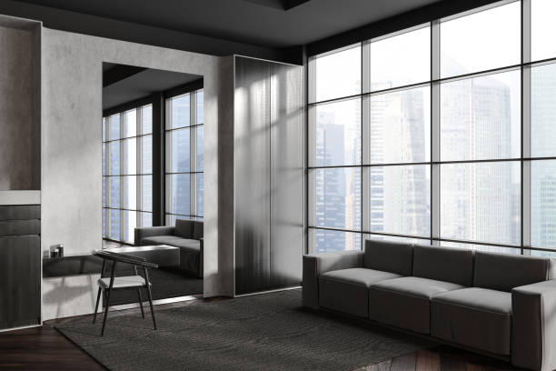 istock Grey relaxing room interior with couch and dresser, panoramic window 1448347410