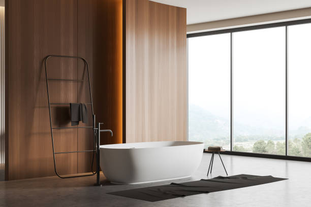 istock Stylish bathroom interior with tub near panoramic window. Empty wall 1448348203