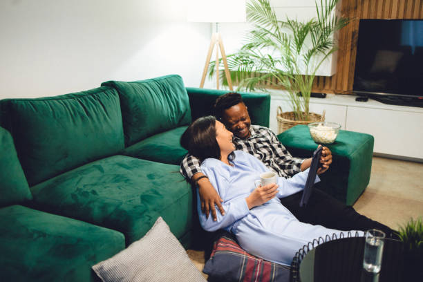 istock Multiracial heterosexual couple enjoying media at home 1448349841