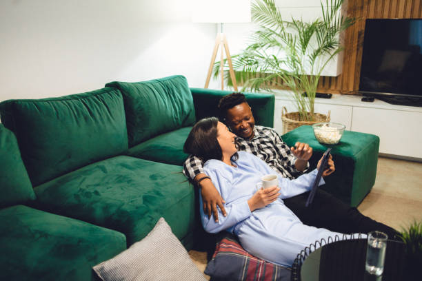 istock Multiracial heterosexual couple enjoying media at home 1448350014