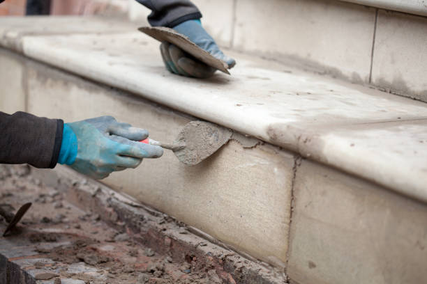 istock Builder Repairing Stone Step On Victorian House 1448351736