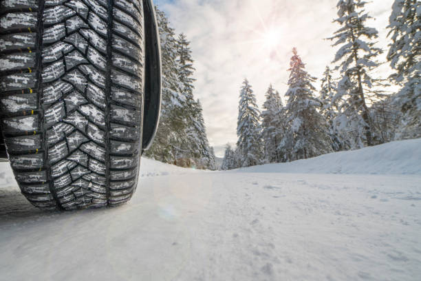 istock winter tires on snowy road 1448351872