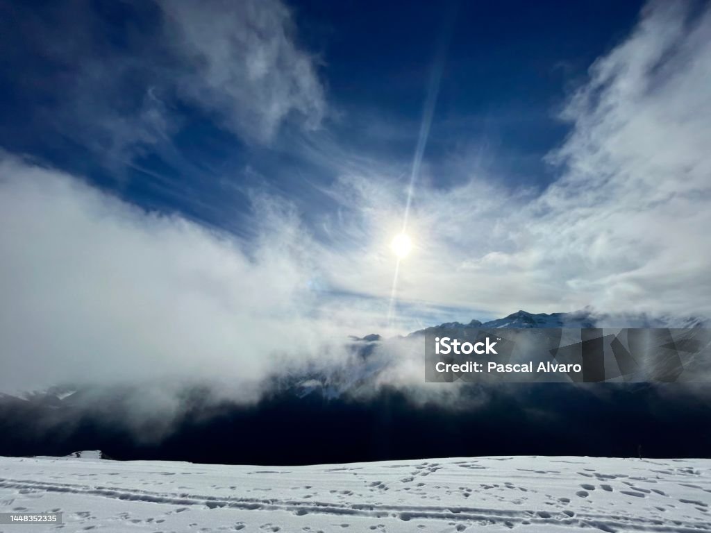 When the mountain puts on its beautiful snow coat Wonderful colours, splendid skies, clouds that look like cotton... the magic of winter in the mountains Adventure Stock Photo