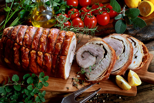 Porchetta - traditional Italian rolled pork belly stuffed with mincemeat and herbs