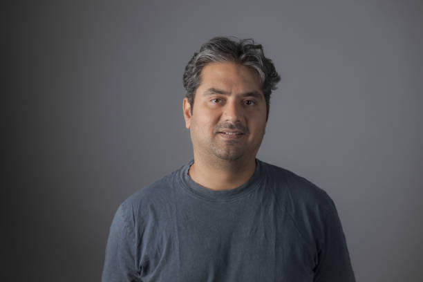 istock Portrait of Indian man looking at camera smiling 1448358452