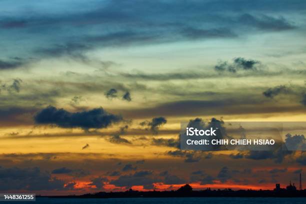 Dramatic Sunset Cloudscape With Sea And City Stock Photo - Download Image Now - Abstract, Aerial View, Backgrounds