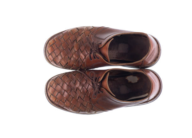 istock old leather brown shoes isolated on white background 1448362766