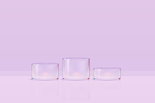 Round transparent poduim, crystal stage for beauty cosmetics advertisement. Cylinder glass stands for product display.