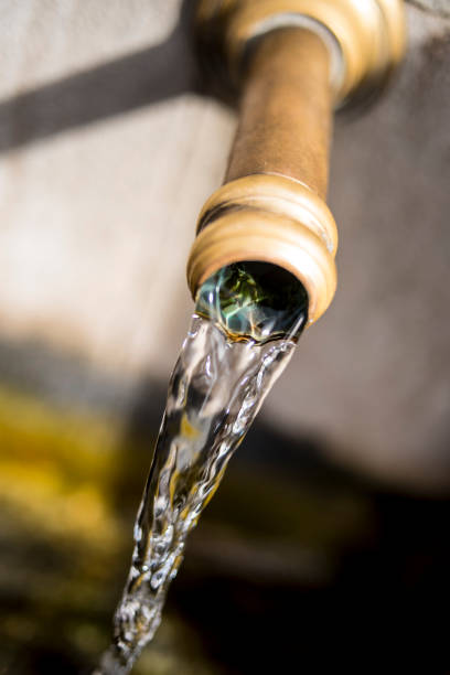 istock Old water pipe pouring crystal clear water 1448365132