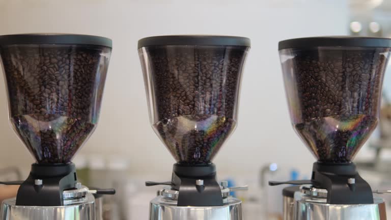 Many containers with different varieties of black coffee to choose from for gourmets and connoisseurs of the drink. Whole coffee beans for making freshly ground and brewed coffee.