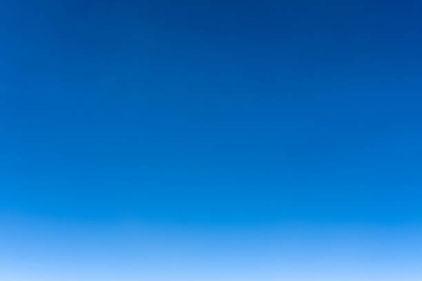 istock Bright blue sky gradient background. Clear empty sky texture, blank skyscape poster with no clouds. 1448373137