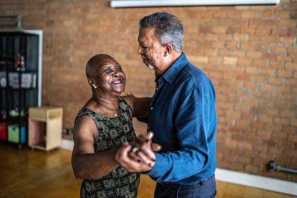 istock Senior couple dancing waltz in dance hall 1448374525