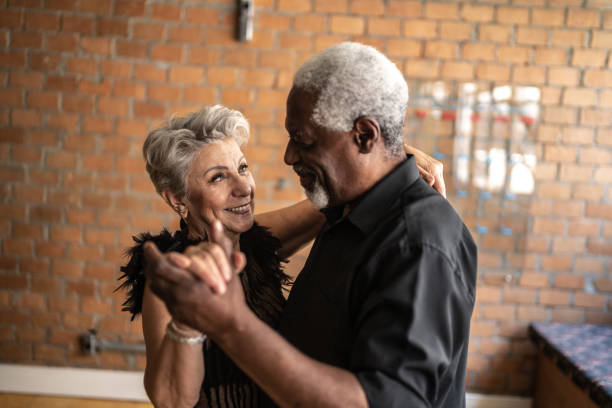 istock Senior couple dancing waltz in dance hall 1448374544