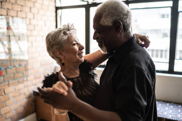 istock Senior couple dancing waltz in dance hall 1448374556