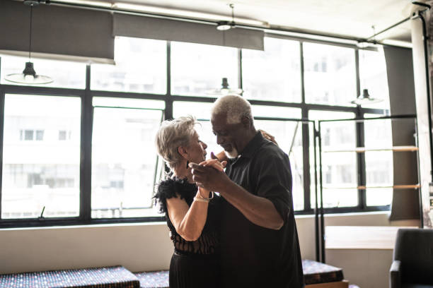istock Senior couple dancing waltz in dance hall 1448374567
