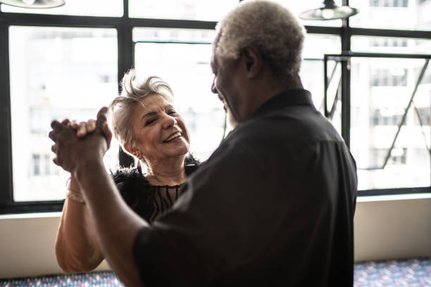 istock Senior couple dancing waltz in dance hall 1448374581