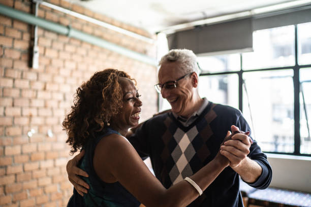 istock Senior couple dancing waltz in dance hall 1448374640