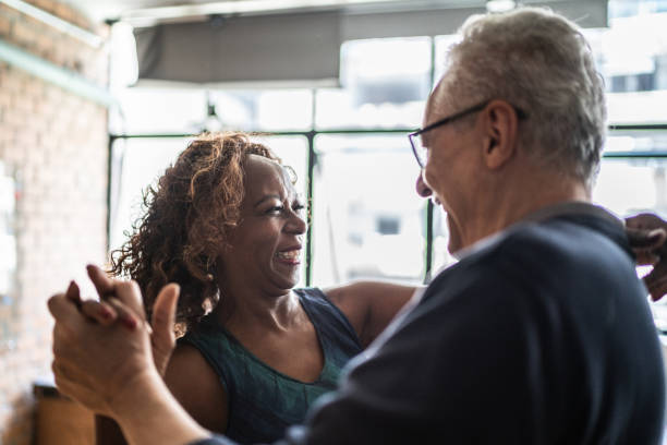 istock Senior couple dancing waltz in dance hall 1448374641