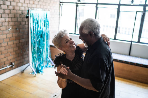 istock Senior couple dancing waltz in dance hall 1448374712