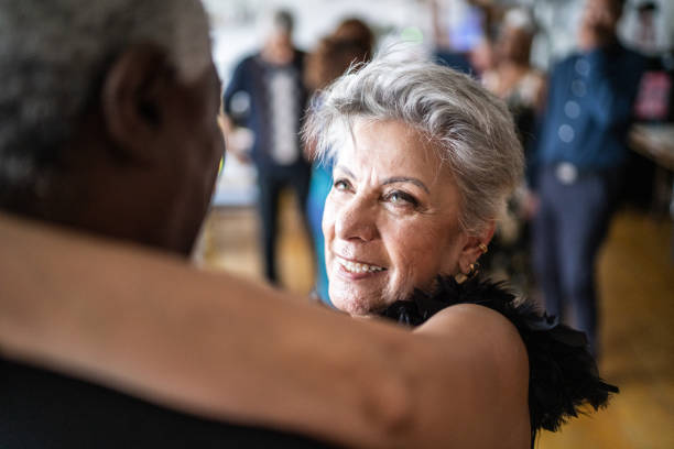 istock Senior woman dancing with her husband in dance hall 1448374725