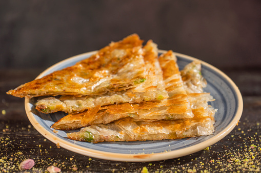 Turkish Food - Katmer Kattama , Katlama, Katmer or gambir is a fried layered bread common in the cuisines of Central Asia. Turkish katmer a thin phyllo pastry stuffed with sheep cheese, pistachios, and sugar served for breakfast in Gaziantep cuisine, Turkey