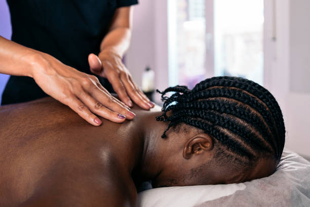 istock Relaxed African Man Receiving Massage 1448375896