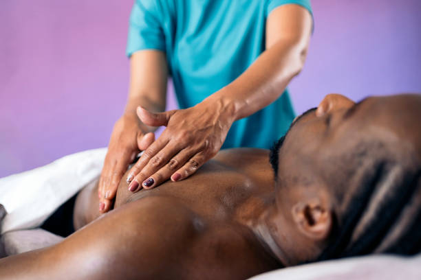 istock Relaxed African Man enjoying Massage 1448375917