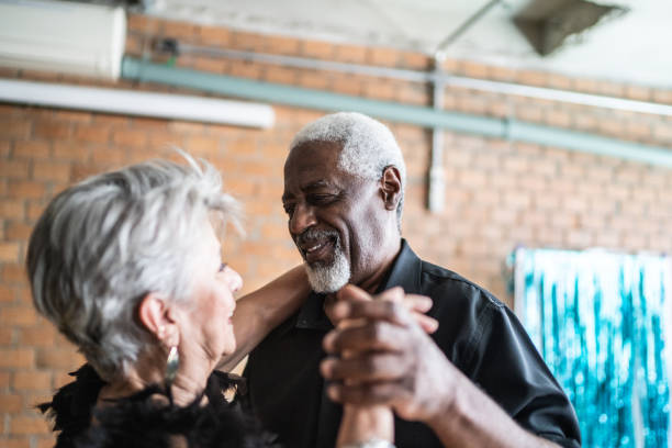 istock Senior couple dancing waltz in dance hall 1448376337