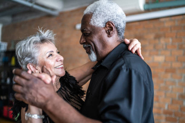 istock Senior couple dancing waltz in dance hall 1448376341